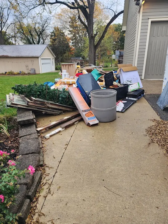 Dumpster being loaded with debris for Roofing Dumpster Rental in Meridian